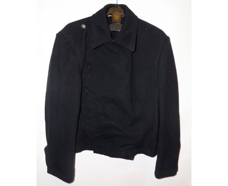 A German Army pattern Panzer black serge cross over jacket, all insignia removed but marks still visible, traces of maker’s s