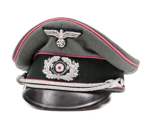 A German Army Panzer officer’s peaked cap, field grey with dark green band and pink piping, with silver bullion insignia and 