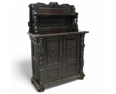Victorian heavily carved oak chiffonier, raised panelled back fitted with shelf, cared with scrolls and flower heads, moulded