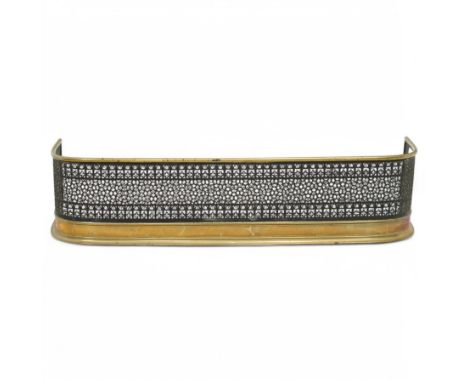 Early Victorian brass and pierced steel serpentine fireplace fender, with arched trellis-style gallery and stepped brass base