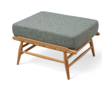 Lucian Ercolani for Ercol - footstool model number 443, upholstered in grey fabric, on elm and beech base Dimensions: Height: