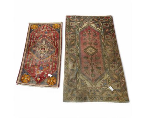 Persian crimson ground rug, decorated with small geometric motifs and animals (158cm x 83cm); together with a Turkish rug (20