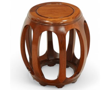 20th century Chinese hardwood drum-shaped stool or side table, circular top above shaped apron raised on eight curved scroll-