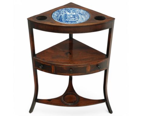George III mahogany corner washstand, with a later Spode shaving bowl and receptacles for two small cup-sized bowls, with thr