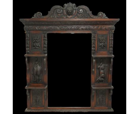 Victorian heavily carved overmantel mirror, scroll and mask carved pediment over shelves bevelled rectangular mirror, decorat