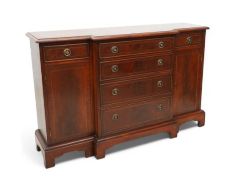 Early 20th Century break front mahogany sideboard, the rectangular top above an arrangement of two short and four graduated l