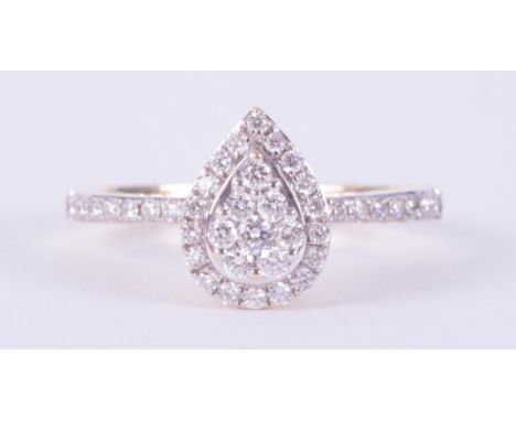 An 18ct yellow gold cluster style ring set in a pear shape set with round brilliant cut Canadian diamonds, total diamond weig