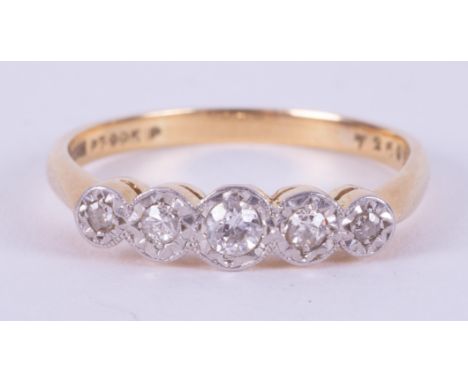 An 18ct yellow gold &amp; platinum five stone ring set with five small round cut diamonds in an illusion setting, 3.12gm, siz