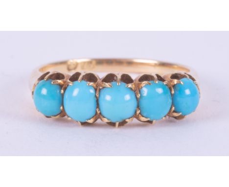 An 18ct yellow gold ring set with five oval cabochon cut turquoise stones, 3.08gm, size N.