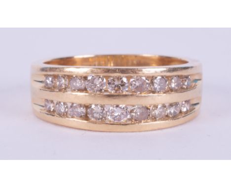 An 18ct yellow gold two row ring set with 0.75 carats of round brilliant cut diamonds, 5.82gm, size N.