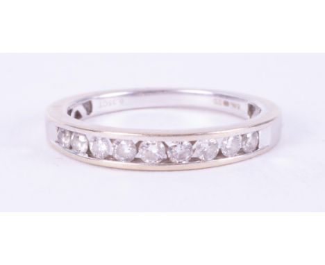 An 18ct white gold half eternity style ring set with approximately 0.35 carats of round brilliant cut diamonds, colour G-H an