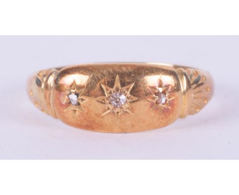 A yellow gold antique ring (no hallmarks &amp; not tested) set with three old cut diamonds in a gypsy style setting, 2.62gm, 