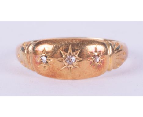 A yellow gold antique ring (no hallmarks &amp; not tested) set with three old cut diamonds in a gypsy style setting, 2.62gm, 