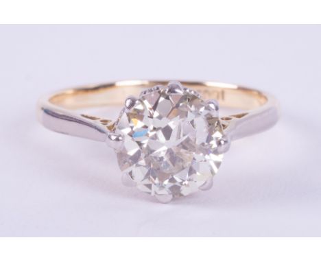 An 18ct yellow gold &amp; platinum solitaire ring set an older round cut diamond, approx. 2.00 carats, assessed colour J-K &a