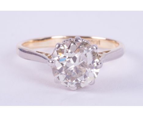 An 18ct yellow gold &amp; platinum solitaire ring set an older round cut diamond, approx. 2.00 carats, assessed colour J-K &a