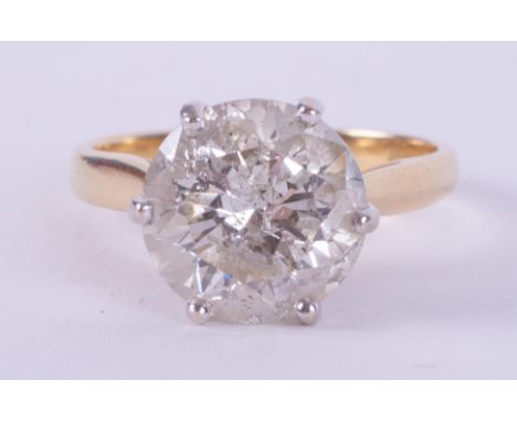 An 18ct yellow gold &amp; platinum six claw solitaire ring set with approx. 3.20 carats of round brilliant cut diamond, appro