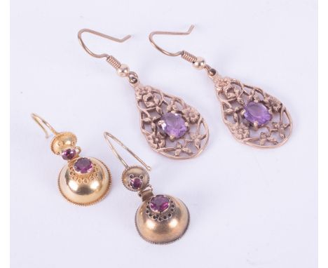 Two pairs of earrings to include a pair of 9ct gold ornate flower designed drops set with a central oval cut amethyst, 4.07gm