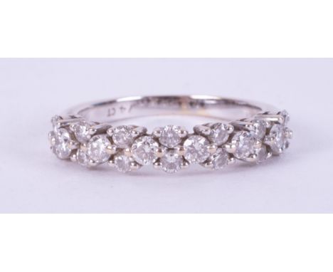 An 18ct white gold zig zag design ring set with approx. 0.74 carats or round brilliant cut diamonds, 3.03gm, size K.