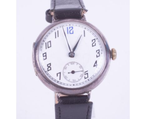 A silver 'trench' style wrist watch, mechanical hand wind movement, classic arabic 1920 style, blue 12 o'clock, second subsid