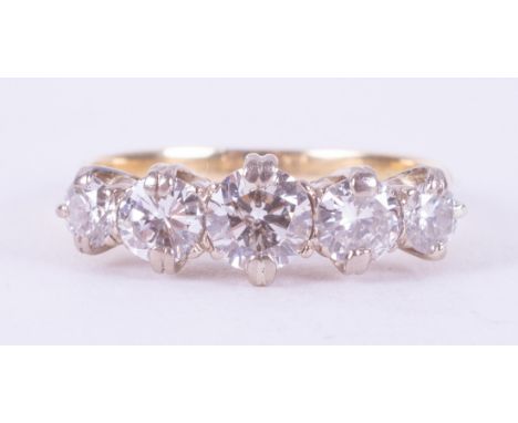 An 18ct yellow &amp; white gold ring set with five older cut round diamonds, total weight of diamonds is approx. 1.56 carats 