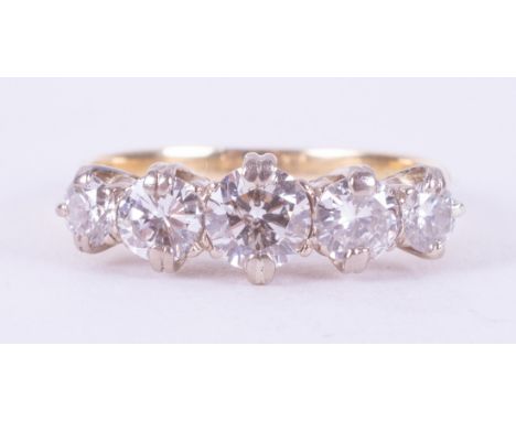 An 18ct yellow &amp; white gold ring set with five older cut round diamonds, total weight of diamonds is approx. 1.56 carats 