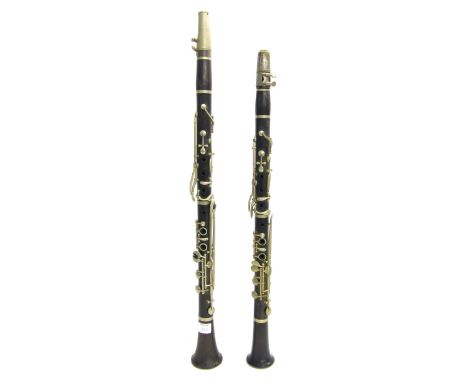 Rosewood and nickel mounted clarinet by and stamped Rudall Carte & Co (at fault); together with another rosewood and nickel m