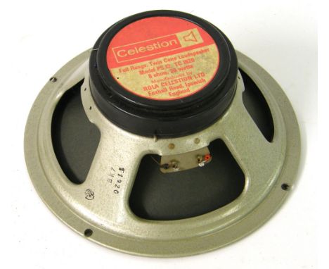 Celestion 12" speaker, together with an old flight case and various guitar leads