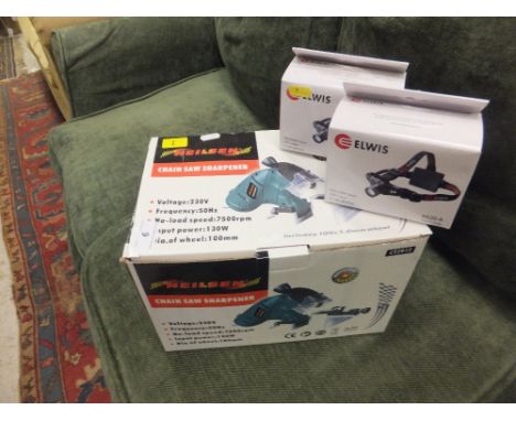 A 240 volt Neilsen chainsaw sharpener, together with two Elwis LED headlamps *