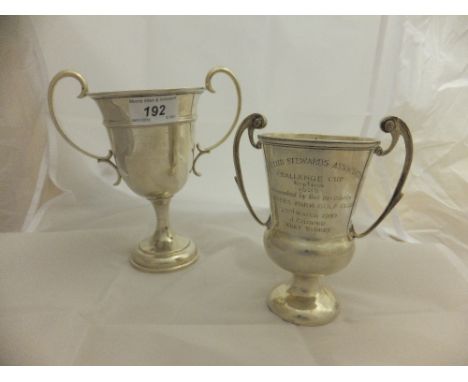 A George V silver twin-handled golf trophy inscribed  "To The Golf Club Stewards Association Challenge Cup Replica 1922" (Lon