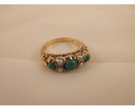 A 9 carat gold dress ring set with seed pearls and jade beads