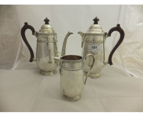 A George V silver coffee pot, water jug and cream jug (by Barker Bros. Silver Limited, Birmingham, 1933 and 1939) CONDITION R