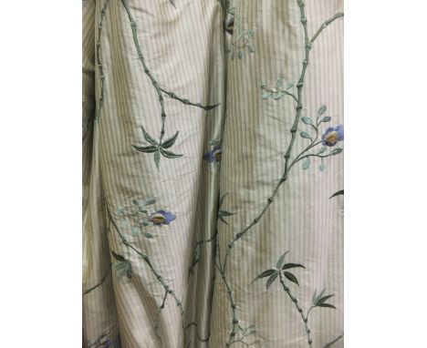 Two pairs of silk interlined curtains, the white and green striped ground set with floral sprays together with a matching bed