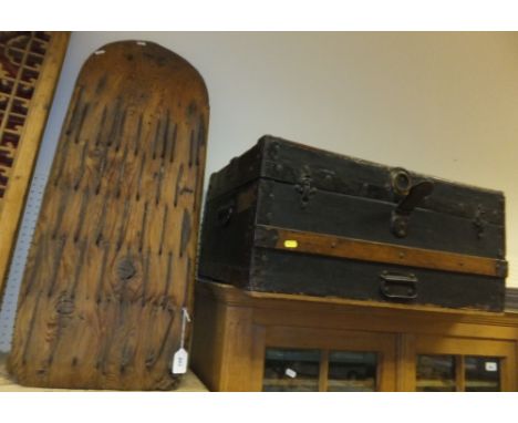 A Continental pitch pine grain sledge, together with a black painted canvas covered and wooden trunk with metal mounts, inscr