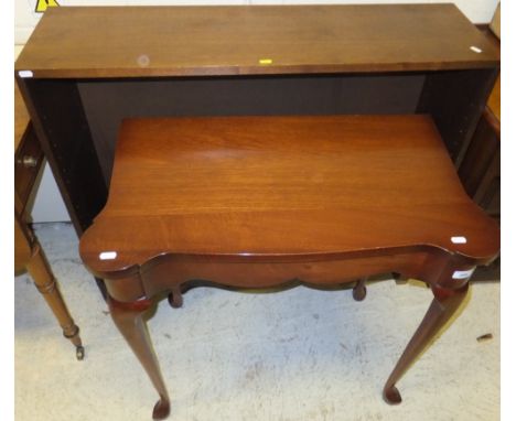 A mahogany shaped top side table, together with a mahogany two shelf open bookcase