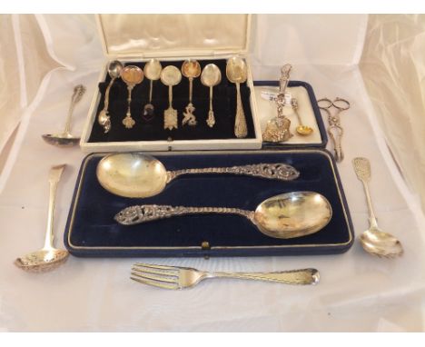 A pair of silver serving spoons with cast C scrolling handles (Sheffield, 1894), together with various other silver spoons, t