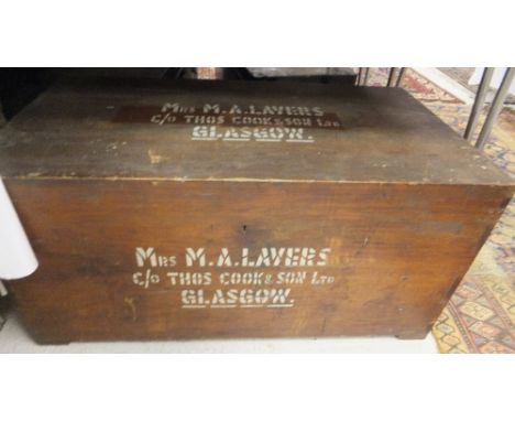 A wooden trunk "Mrs M. A. Lavers", together with two black tin trunks and a twisted wooden walking stick CONDITION REPORTS Wo