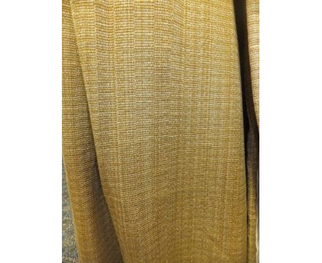 A pair of woven golden interlined curtains with integral pelmets