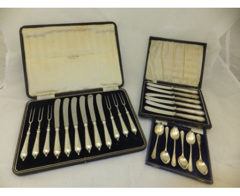 A cased set of six George VI silver handled fruit knives and forks (two prong) (by Thomas Bradbury & Sons Limited, Sheffield,