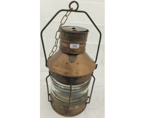 A brass ship's light with clear glass cylindrical shade with brass plaque "Not Under Command" CONDITION REPORTS Wear, tarnish