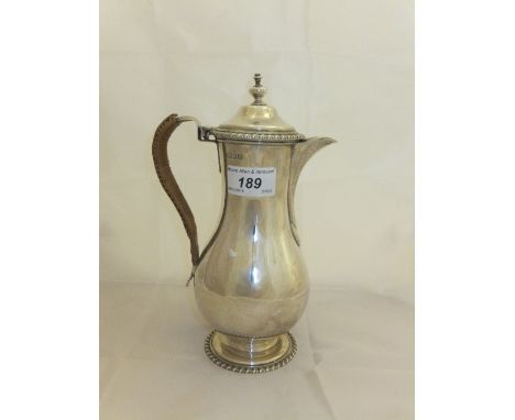 An Edwardian silver baluster shaped water jug in the Georgian taste (by John and Frank Pearpoint, London, 1908)