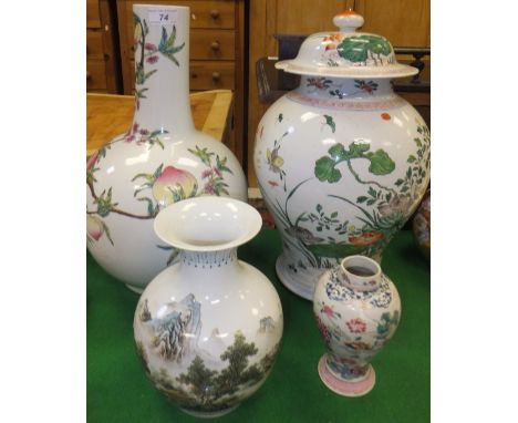 A large Chinese porcelain bottle shaped vase decorated with peaches, a modern Chinese porcelain jar and cover decorated in th