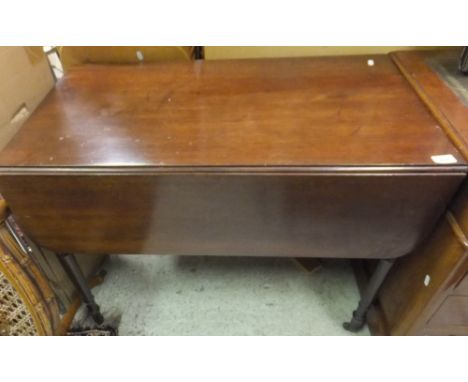 A 19th Century mahogany Pembroke table raised on turned and ringed legs to brass caps and castors CONDITION REPORTS Assorted 