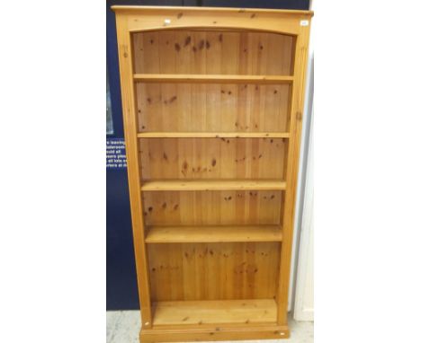 A modern pine five shelf open bookcase