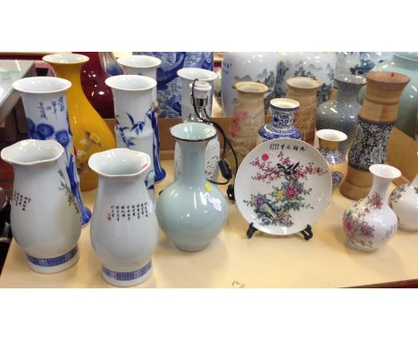 A quantity of Oriental vases, a table lamp and a plate 