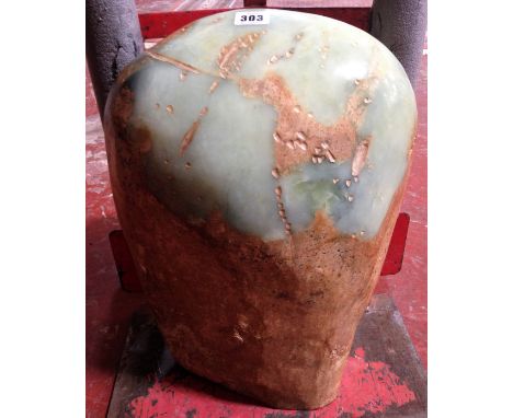 A modern jade rough boulder