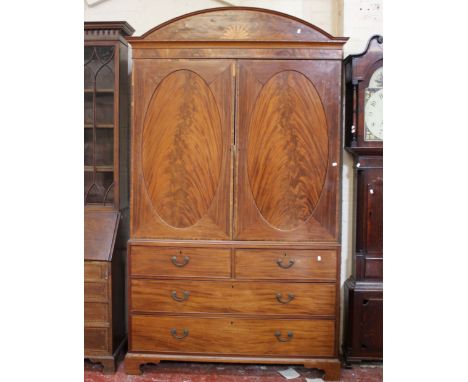 A Georgian mahogany and inlaid linen press, the cupboard above two short and three long drawers on bracket feet 236cm high, 1