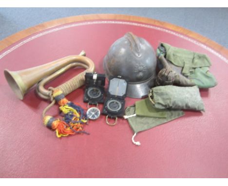 Assorted Militaria,comprising a French Helmet, No.36 Hand Grenade converted to a lighter, three assorted compasses, bugle etc