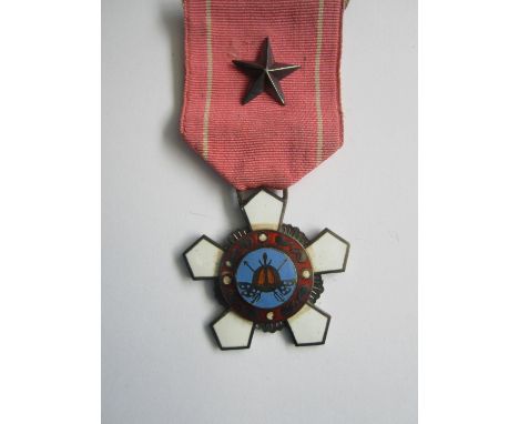 Korea,Order of Military Merit, 4th Class. In case of issue with riband bar for uniform. Scratch to centre of medal otherwise 