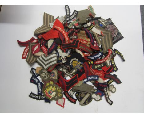 British Cloth Insignia,an assortment of shoulder titles, rank badges, trade badges etc.  A number of unissued examples, some 