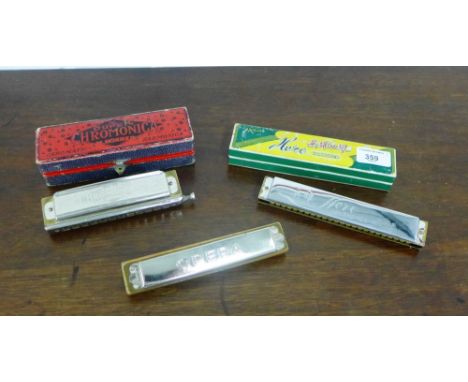 The Super Chromonica by M. Hohner, complete with its original box, together with a Opera Harmonica and a Hero Harmonica, (3) 